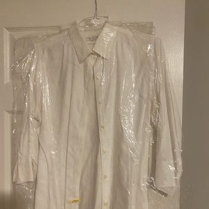 Button down work shirt in dry cleaners bag.